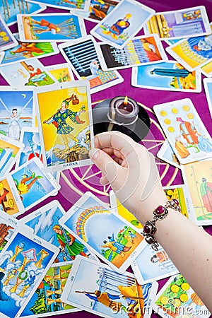 The Fool. Tarot card held in hand. Stock Photo