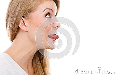 Funny blonde woman sitcking tongue out Stock Photo