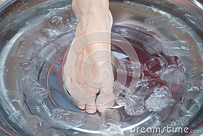 Foot care, Soak your feet in cold water Stock Photo