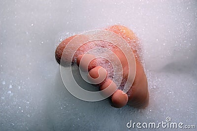 Foot in lather Stock Photo