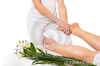 Foot massage on white background Stock Photo