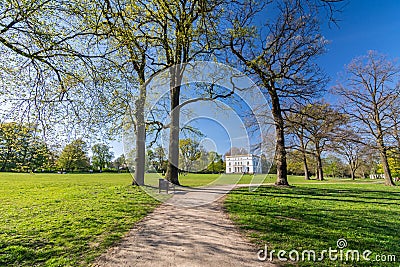 Foot path in a beautiful landscaped park Jenischpark in Hamburg, Germany Stock Photo