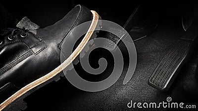 Foot pressing foot pedal of a car to drive. Accelerator and brake pedal in a car Stock Photo