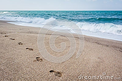 Foot print on the sand of Black Sea. Shoe prints on the beach. S Stock Photo