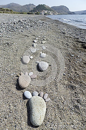 Foot prints of stones on beach Lesvos Stock Photo