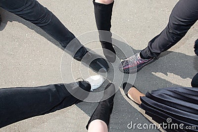 Foot shoes girls and women standing in circle star Stock Photo
