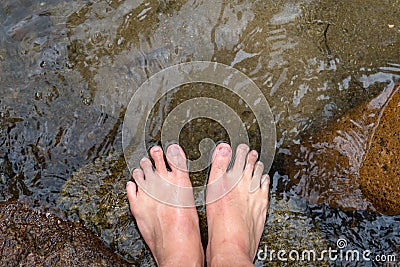 Foot soak in water Stock Photo