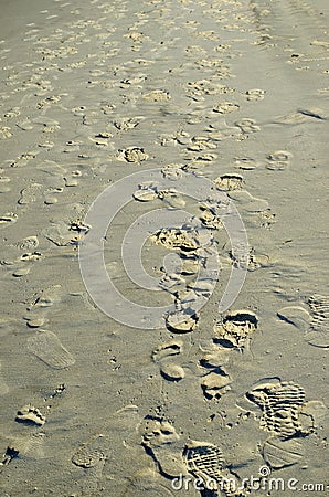 Foot steps at beach Stock Photo