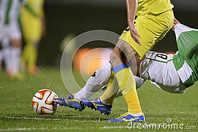 Football action - hard tackle Editorial Stock Photo