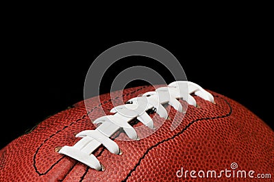 Football Closeup Isolated on Black Stock Photo