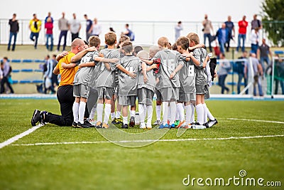 Football Coaching. Young Boys Having Pep Talk with Coach Before the Tournament Match Editorial Stock Photo