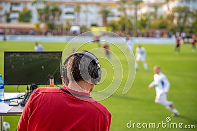 Commentator on outdoor football game Editorial Stock Photo