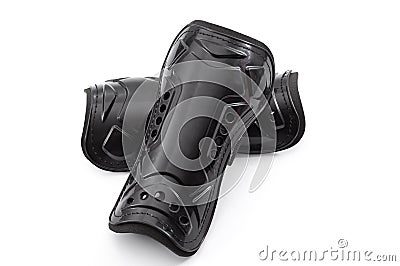 Football equipment, injury and bruise prevention and soccer gear concept with tough black shin guards isolated on white background Stock Photo