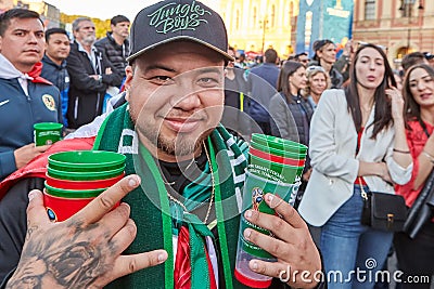 Football fan with empty glasses of beer, Russia, St. Petersburg. Editorial Stock Photo