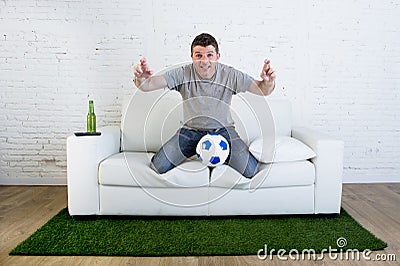 Football fan watching tv soccer match suffering stress nervous c Stock Photo