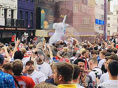 Football fans of England with the national flag glorify their team in the World Cup before the match Editorial Stock Photo