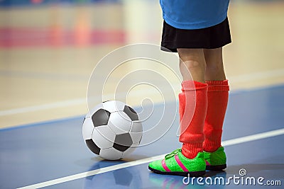 Football futsal training for children. Indoor soccer young player Stock Photo