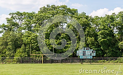 A football goal post and old scoreboard on a field in Swissvale, Pennsylvania, USA Stock Photo