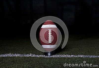 Football Kickoff on dark background Stock Photo