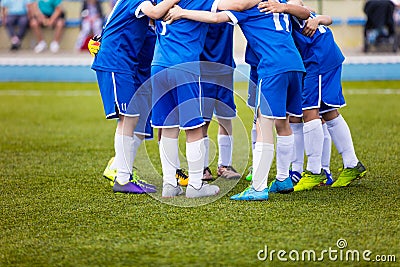 Football match for children. Youth sports team celebrate. Stock Photo