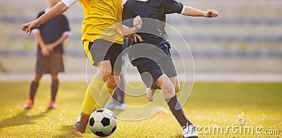 Football match at the stadium. Soccer players competing in summer sunlight Stock Photo