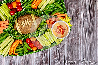 Football meatloaf with vegetable and dipping for Super Bowl fan party Stock Photo