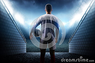 Football player with ball in the stadium Stock Photo