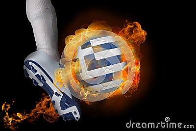 Football player kicking flaming greece flag ball Stock Photo