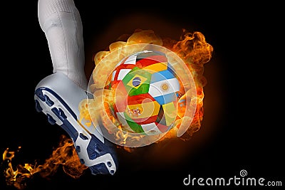 Football player kicking flaming international flag ball Stock Photo