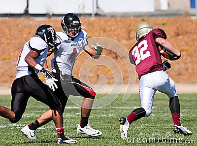 Football Player Running with the Ball During a Game Editorial Stock Photo