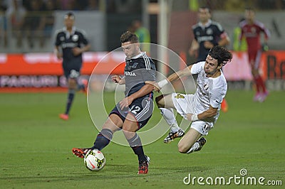 Football players fighting for the ball Editorial Stock Photo