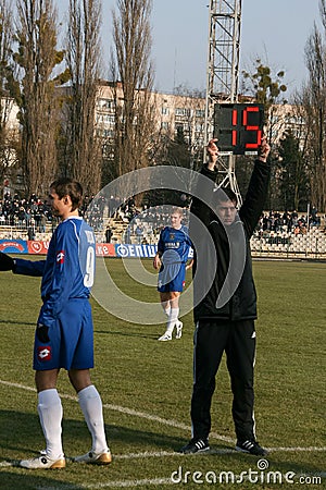 Football referee assistant and board substitution Editorial Stock Photo