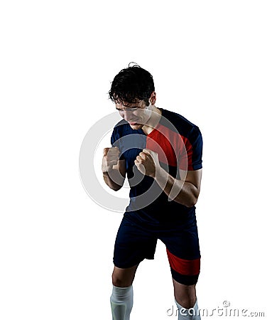 Football scene with a striker soccer player who exults Stock Photo