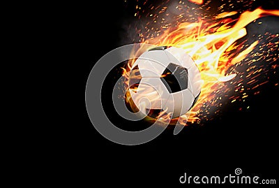 Football soars ahead with heat of blazing fire and smoke with violence on black background,concept of goal setting, success and Stock Photo