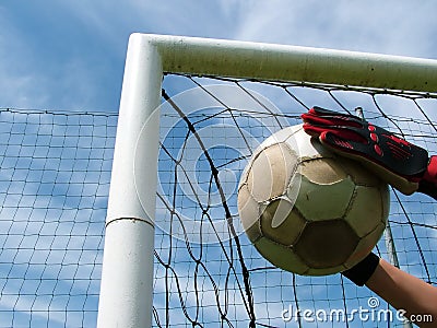 Football - soccer ball in goal Stock Photo