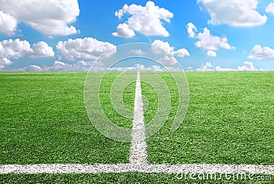 Football and soccer field grass stadium Blue sky background Stock Photo