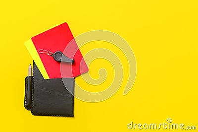 Football soccer referee equipment on yellow background. Top view, space for your text Stock Photo