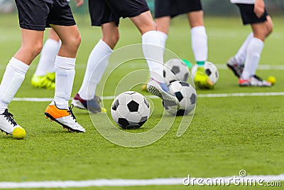 Soccer Training; Football Soccer Training Drills: Young Players Practicing Soccer Run with Ball Stock Photo