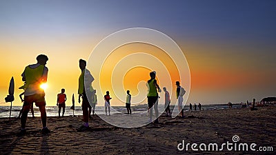 Football sport team is engaged in jogging at sunset Editorial Stock Photo