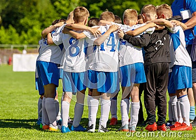 Football Youth Team Huddling with Coach. Young Happy Boys Soccer Players Gathering Editorial Stock Photo