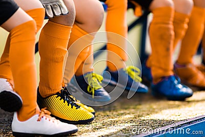 Footballers in soccer cleats. Youth athletes in soccer clothes Stock Photo