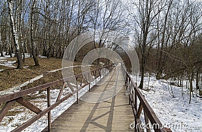 A footbridge at the bottom of a small ravine Stock Photo