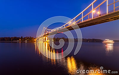 Footbridge in the evening Kiev city. Stock Photo