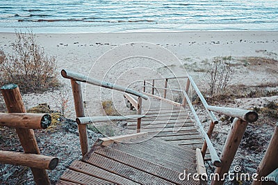 Footbridge over a dune at the beach in Latvia. Stock Photo