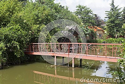 Footbridge in park restaurant Lake Divnoe. Lazarevskoe, Sochi Editorial Stock Photo