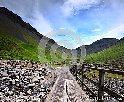 Footbridge to the mountains Stock Photo