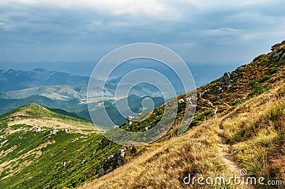 Footpath high in the mountains. Hiking path in the highlands Stock Photo