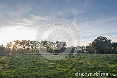 Sunset over a fall meadow Stock Photo