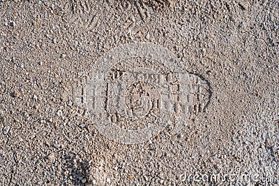 Footprint on clay soil from shoes, close-up, natural material, atmospheric influence, outdoors. Stock Photo