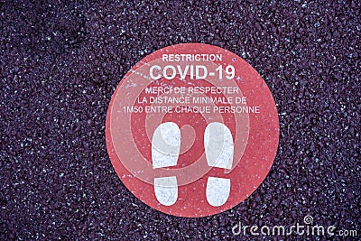 Footprint floor sticker, foot steps in circle, keep distance waiting in line, stand here sign, coronavirus or Covid-19 Stock Photo